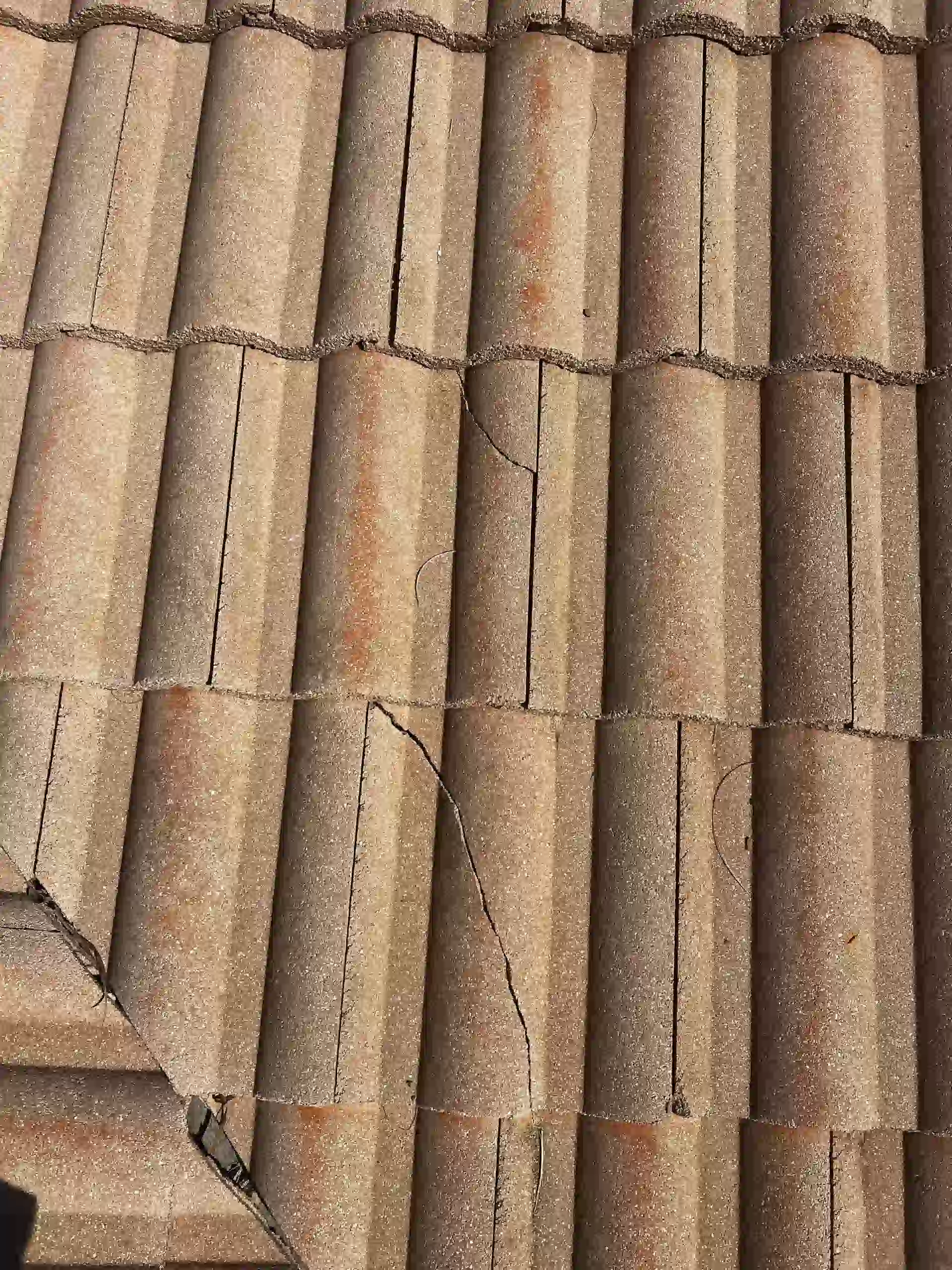 multiple tiles broken on a tile roof 2